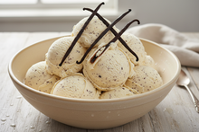 Load image into Gallery viewer, Big bowl of vanilla bean ice cream garnished with vanilla beans