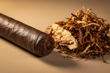 Load image into Gallery viewer, Maduro Cigar and a pile of tobacco 
