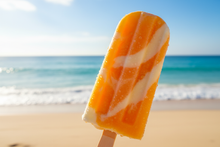 Load image into Gallery viewer, Orange cream popsicle with a beach background
